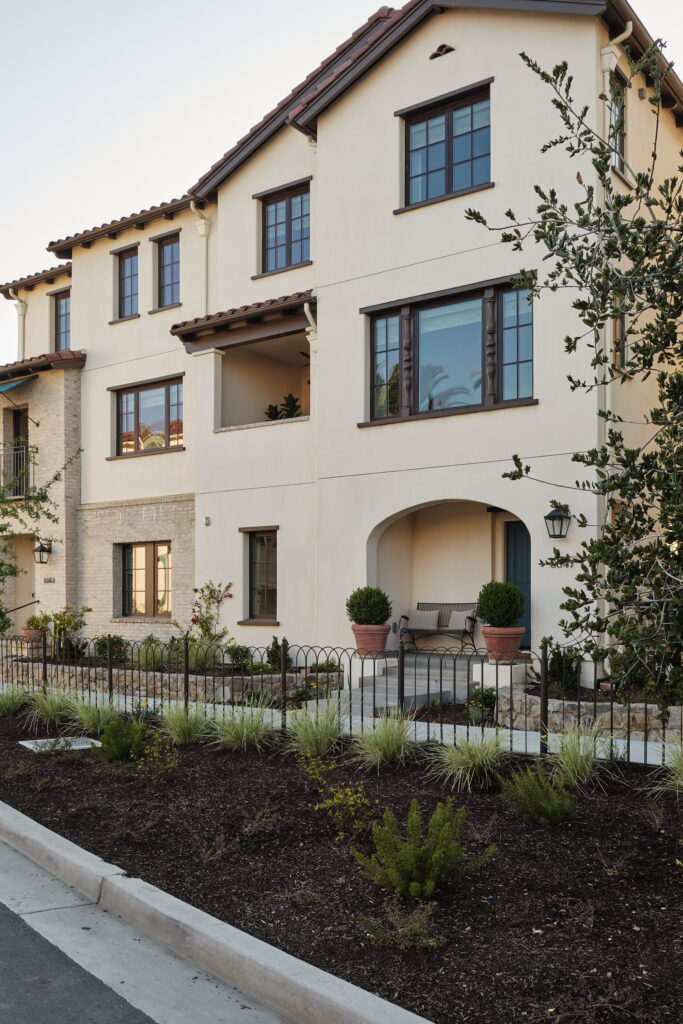 Corner exterior view with balcony and ironwork fence at Marabel in Newark, CA